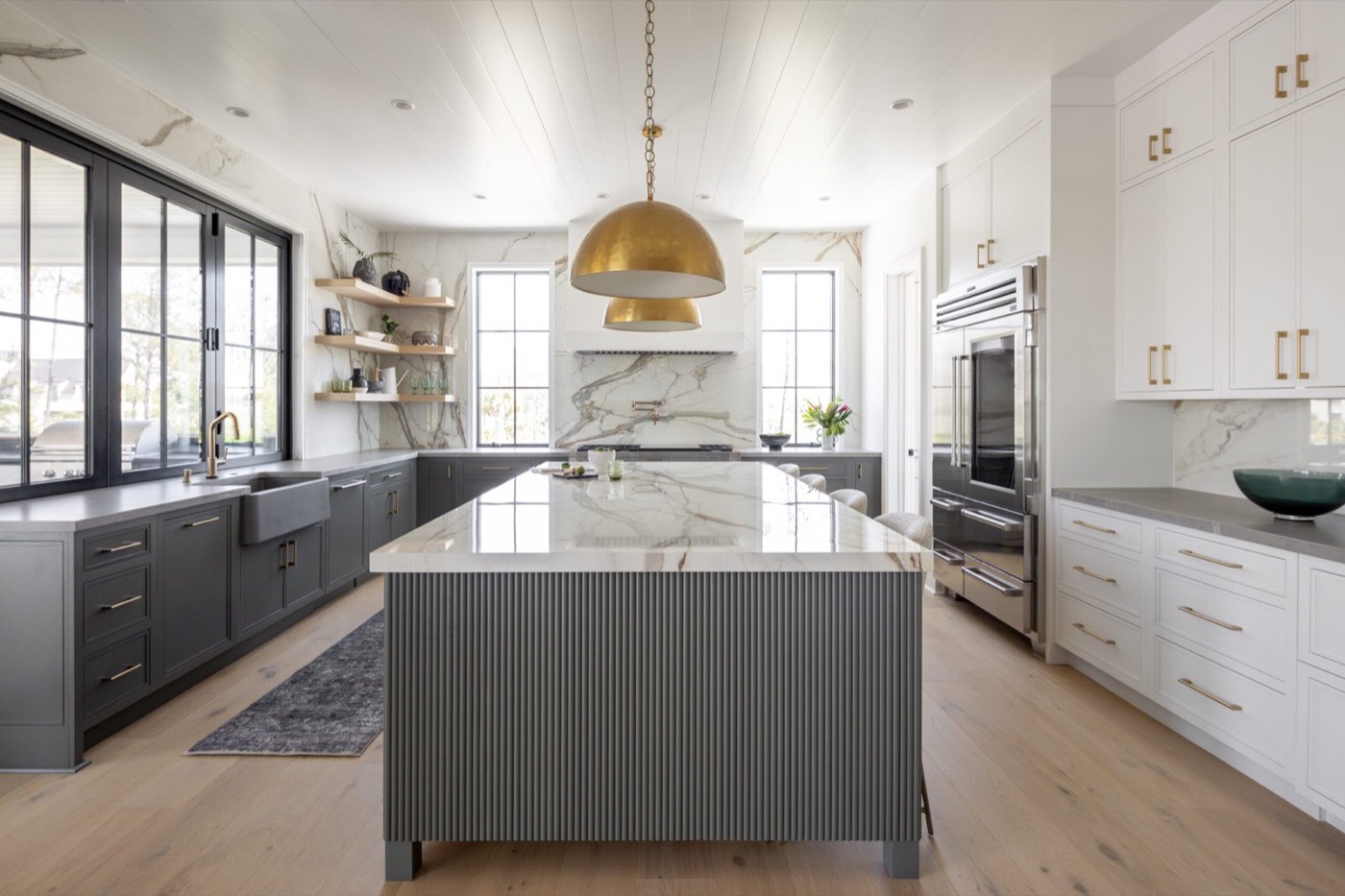 Covered Bridge Cabinetry Jefferson kitchen with a dark island, available at Shoreline Cabinet Company in Wilmington, NC