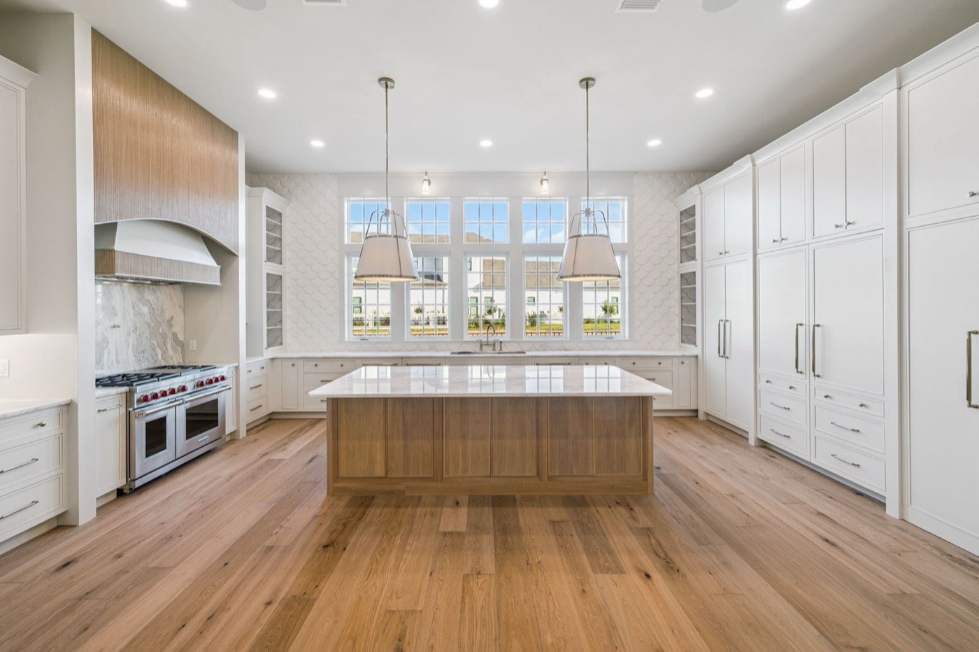 Covered Bridge Cabinetry Hudson kitchen in Fresh Snow and white oak, available at Shoreline Cabinet Company in Wilmington, NC