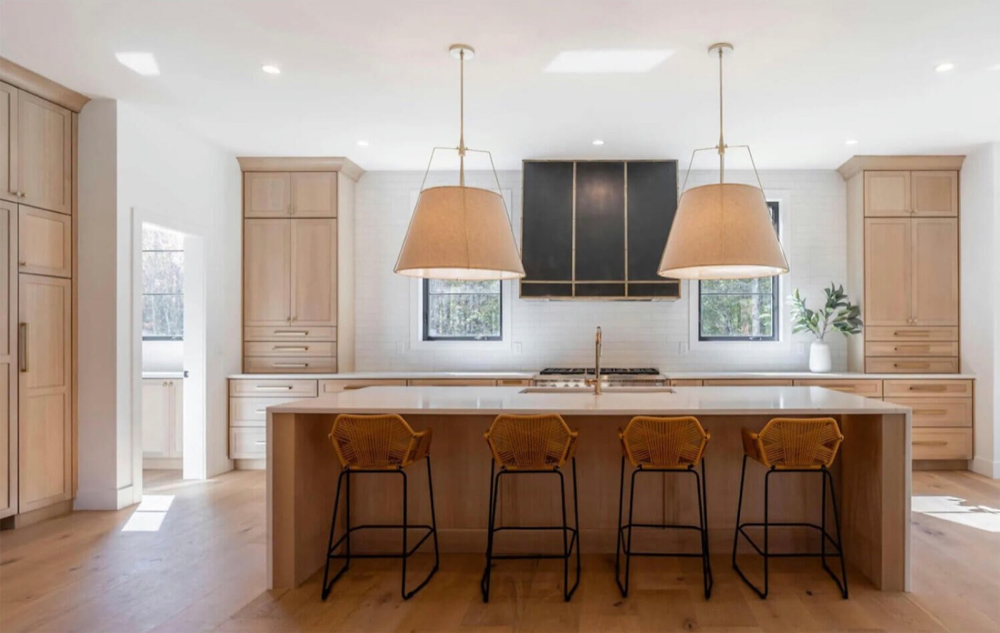 Dura Supreme Cabinetry White oak island in a modern farmhouse kitchen, available at Shoreline Cabinet Company in Wilmington, NC