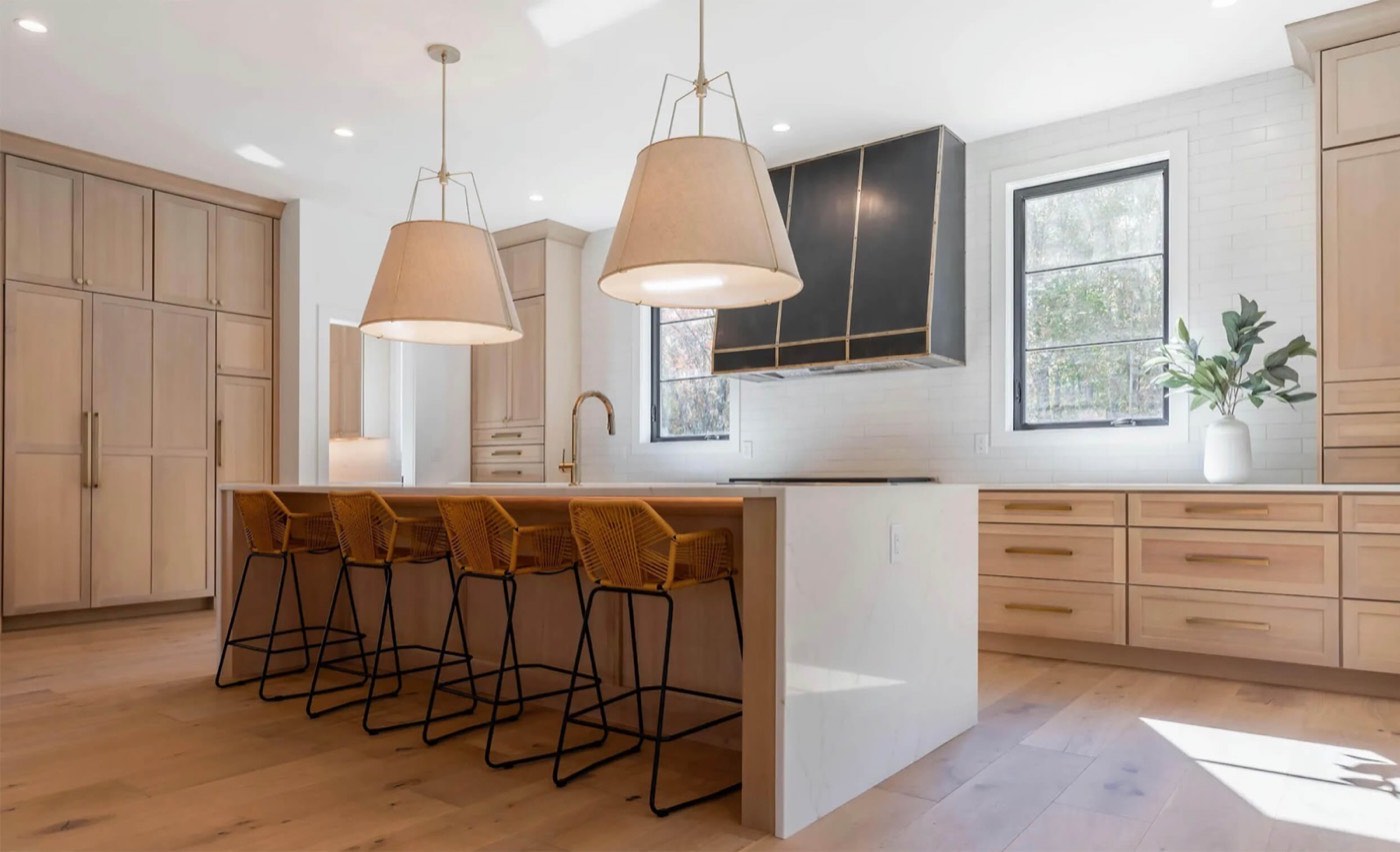 Dura Supreme Cabinetry Modern farmhouse kitchen, Hudson door, Alabaster on Quarter-Sawn White Oak, available at Shoreline Cabinet Company in Wilmington, NC