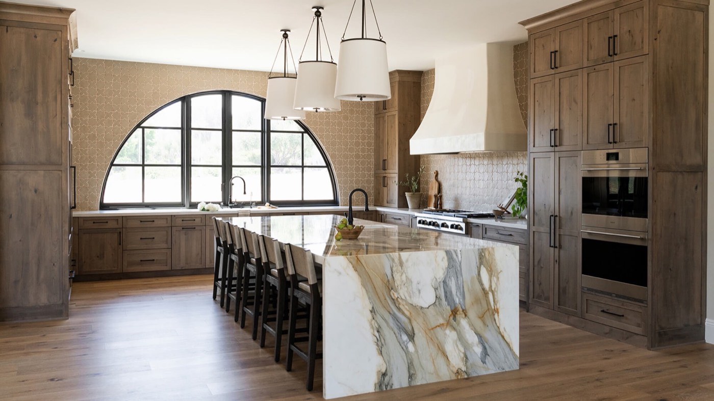 Dura Supreme Cabinetry Terracotta Ridge kitchen, Hudson in Putty paint + Cashew Knotty Alder, available at Shoreline Cabinet Company in Wilmington, NC