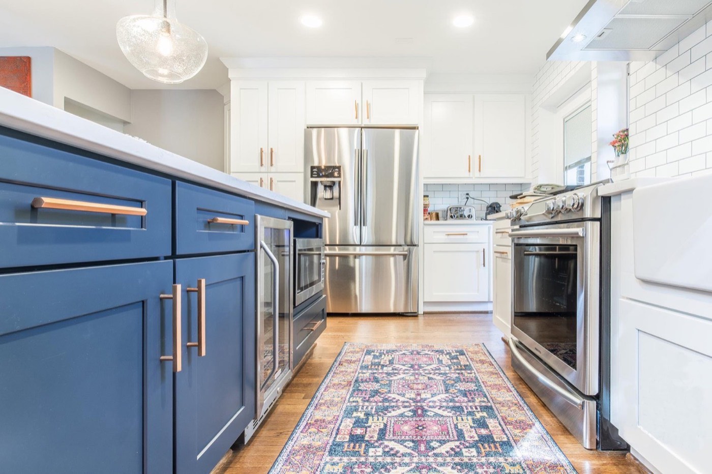 JSI Cabinetry Galley Essex with Navy island, available at Shoreline Cabinet Company in Wilmington, NC