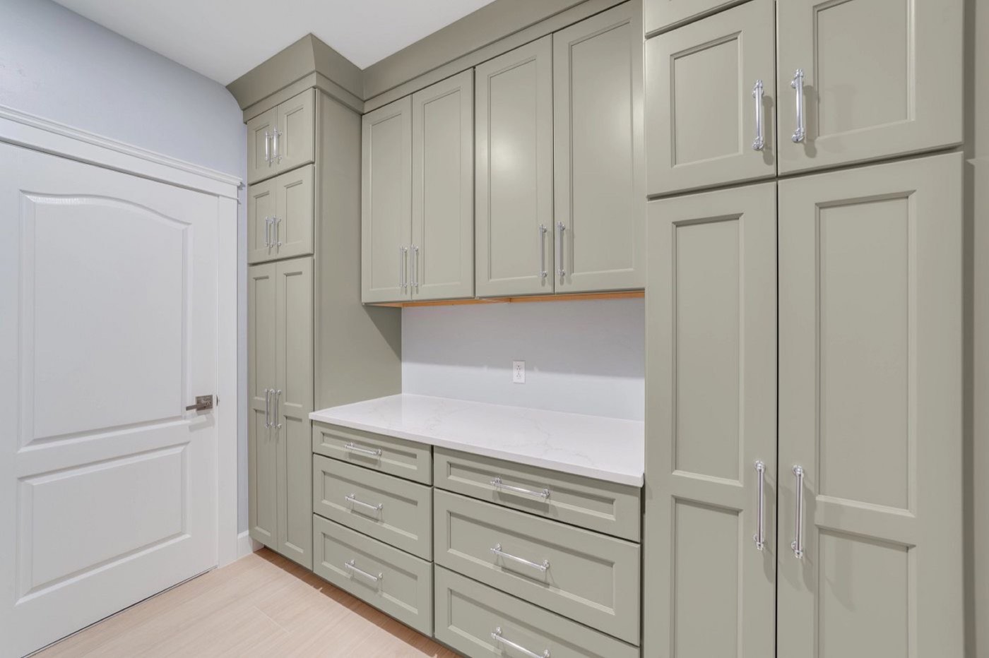 Mantra Cabinets Laundry room, Omni in Mineral, available at Shoreline Cabinet Company in Wilmington, NC