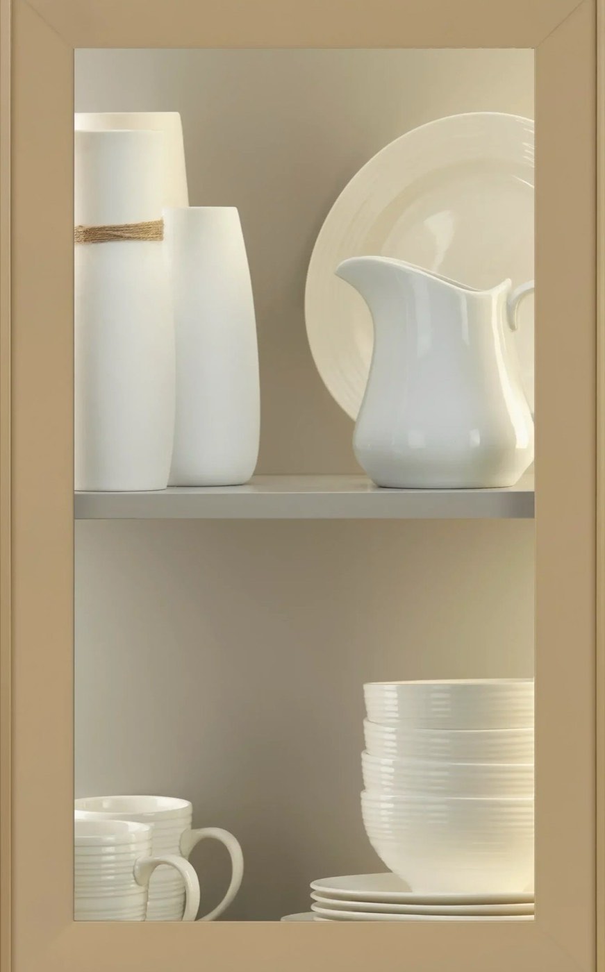 Medallion Cabinetry Catania metal frame door in Gold with clear glass insert, available at Shoreline Cabinet Company in Wilmington, NC
