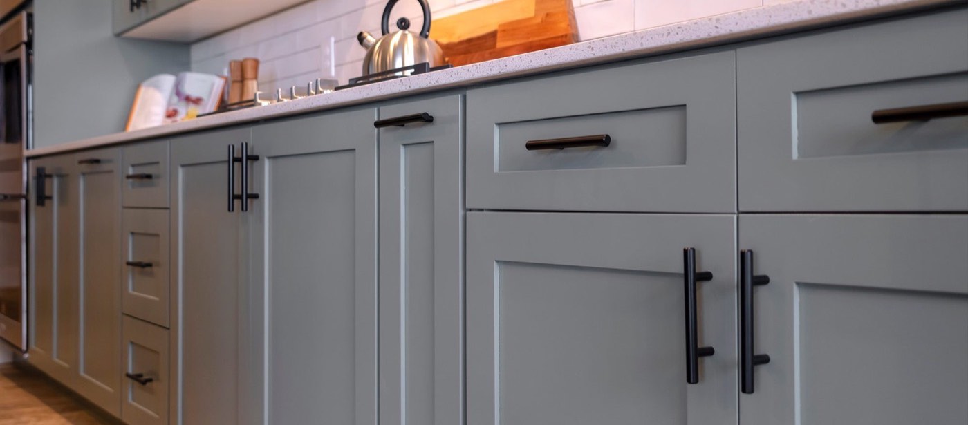 Pride Decor Gray shaker cabinets with bar pulls, available at Shoreline Cabinet Company in Wilmington, NC