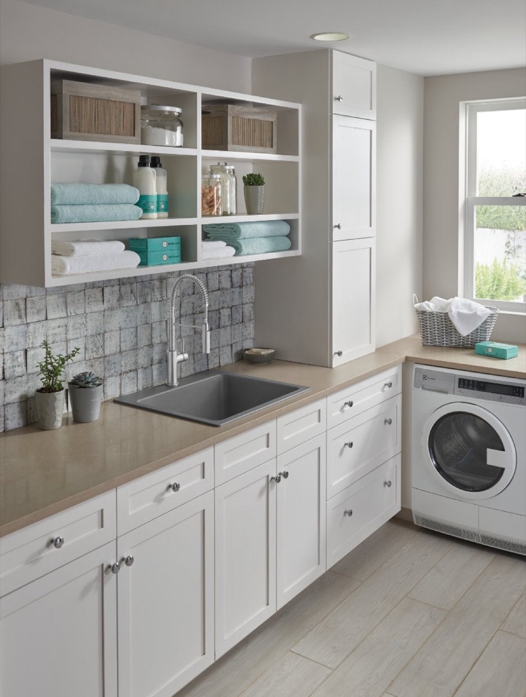 Top Knobs Devon collection knobs in a laundry room, available at Shoreline Cabinet Company in Wilmington, NC