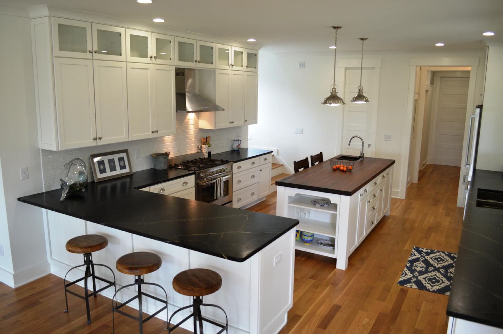 Crisp modern cottage kitchen with white custom cabinetry by Shoreline Cabinet Company, Wilmington NC