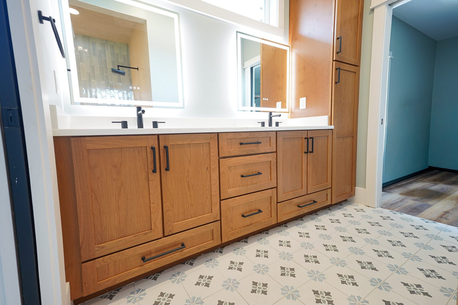 Long stained cherry bathroom vanity with drawers by Shoreline Cabinet Company, Wilmington NC