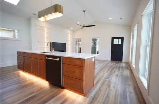 Cherry kitchen island with under-cabinet toe-kick lighting by Shoreline Cabinet Company, Wilmington NC