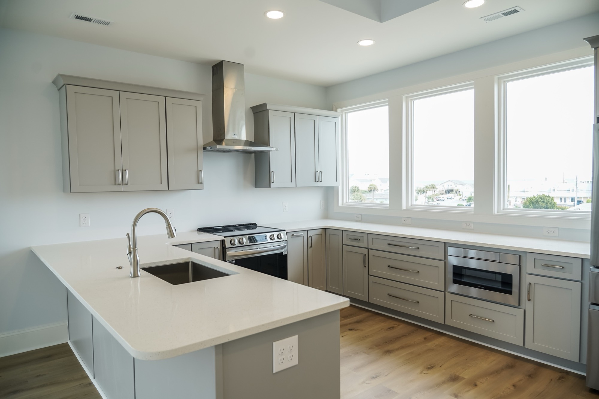 Shaker kitchen island with seating by Shoreline Cabinet Company, Wilmington NC