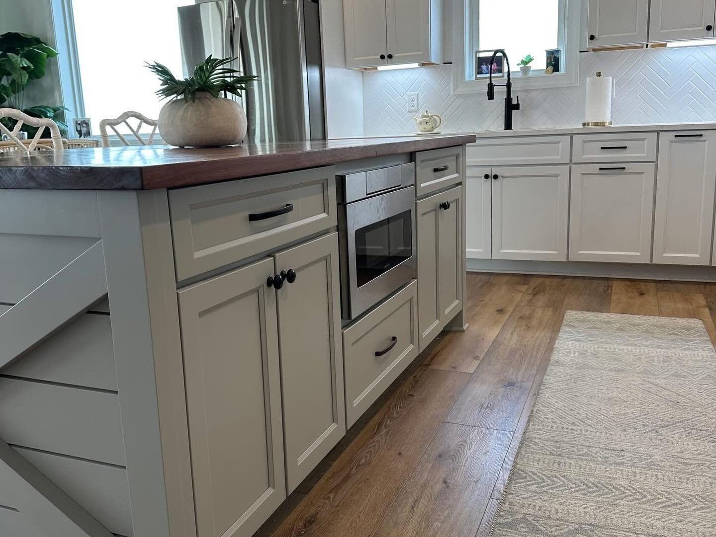 Grey shaker island with an X-brace end and wood top by Shoreline Cabinet Company, Wilmington NC