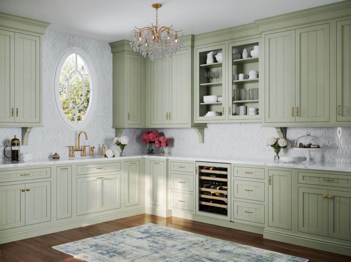 Sage green inset kitchen with a chandelier by Shoreline Cabinet Company, Wilmington NC