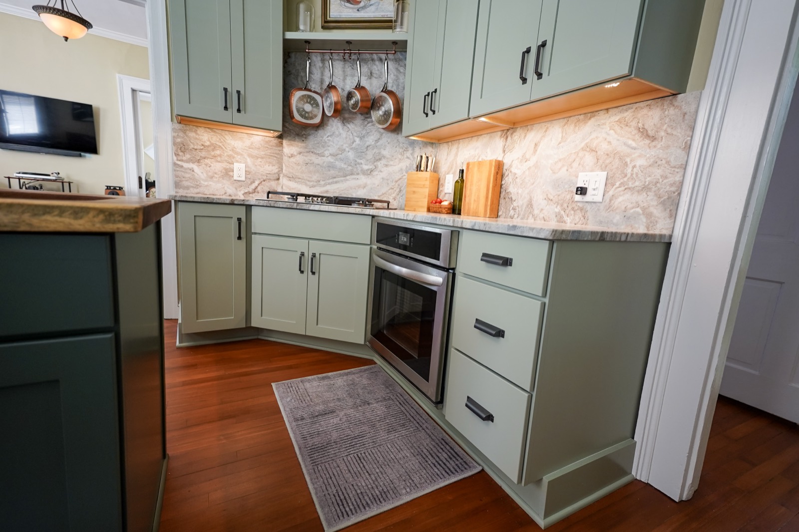 Sage green painted kitchen cabinets by Shoreline Cabinet Company, Wilmington NC