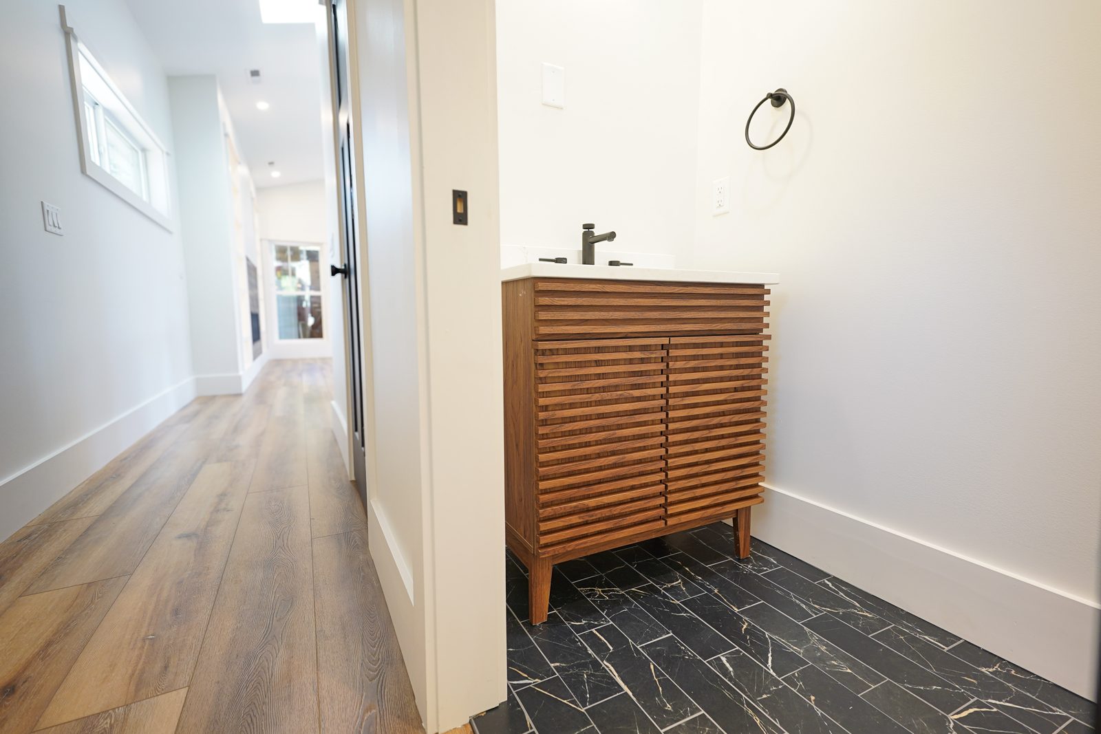 Slatted wood freestanding bathroom vanity by Shoreline Cabinet Company, Wilmington NC