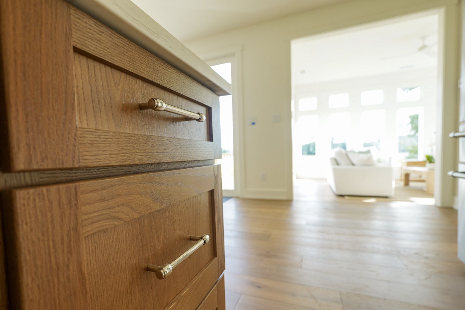 Stack of stained oak drawers with matching pulls by Shoreline Cabinet Company, Wilmington NC