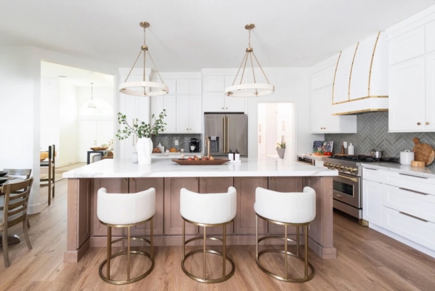 White painted kitchen with a stained oak island and brass hood, Wilmington NC